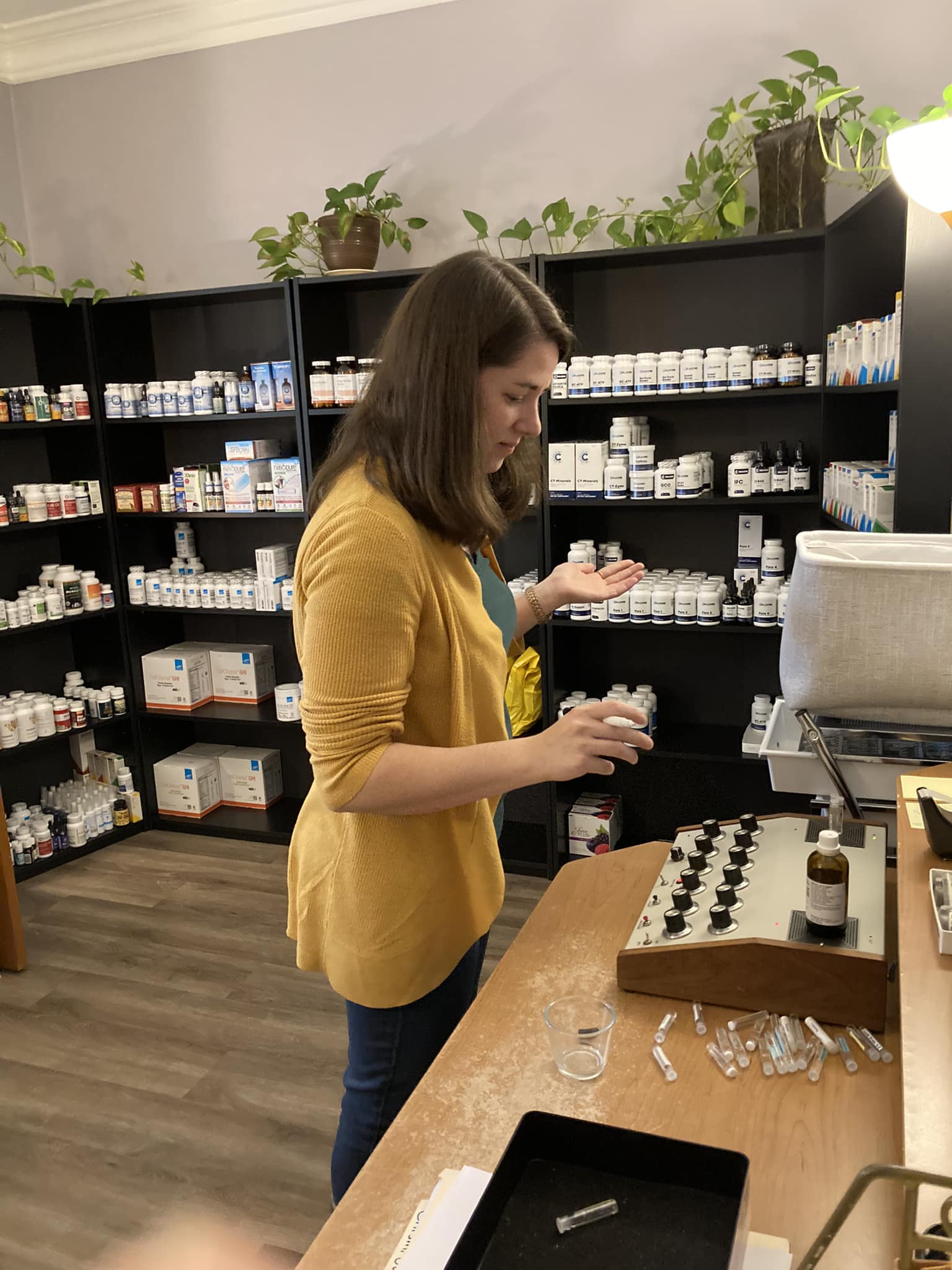 Liz prepares a custom blended homeopathic remedy